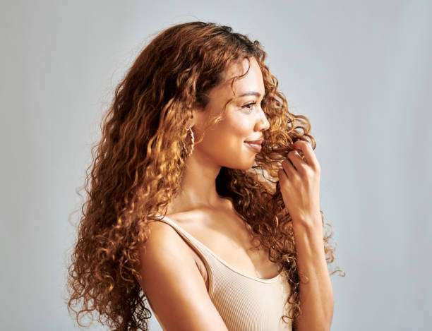 Hair oil, hair treatment and hair care on woman with natural