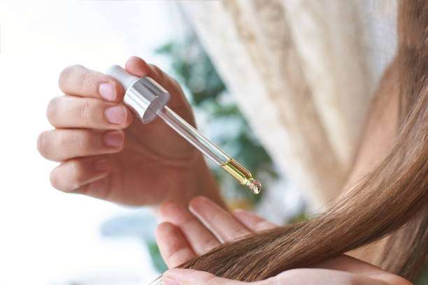 Hair oil, hair treatment and hair care on woman with natural